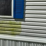 Soft washing a house