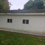 Organic growth and dirt on vinyl siding