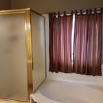 Dated cultured marble tub/shower