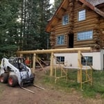 putting up new log columns and a beam