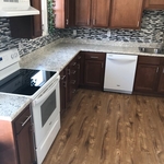 Kitchen remodel cabinets countertop tile backsplas
