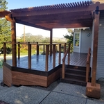 Composite deck with redwood pergola