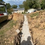 Trench after pipe instillation and stone poured