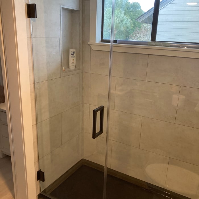 Frameless Door and Panel with Matte Black Hardware