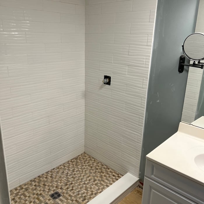 Shower was removed and I replaced it with tile of customer choice