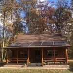 15 panels on log home
