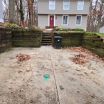 Demolition of rotten lumber retaining wall