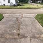 Cleaning cracks and build up grass on drive way