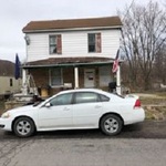 Home prior to any renovations completed in front