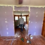 Fixing a wall to add barn doors.