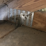 Roof to wall attachment