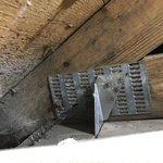 Roof to wall attachment