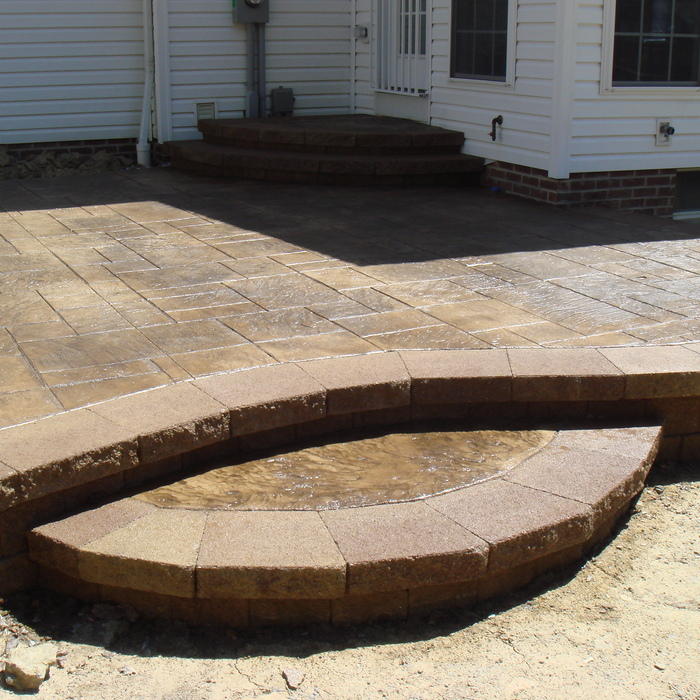 Raised patio with stamped concrete
