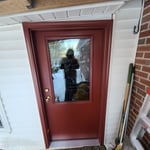 Single entry door under sloped roof