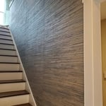 Grasscloth in stairwell.