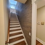 Grasscloth in stairwell.