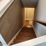 Grasscloth in stairwell.
