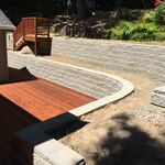 Built retaining wall with planters