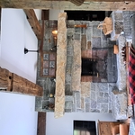 48 inch Rumford fireplace. Built out of full bed Adirondack granite. We call this one the "Flintstone Hearth". And yes that's one big stone for the mantle, all 3,600lbs of her!