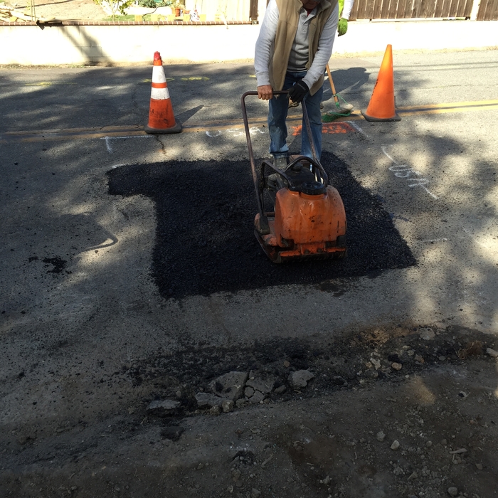 Pour asphalt after at the street