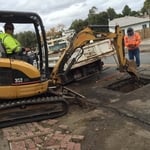 Excavate access hole to expose line and repair