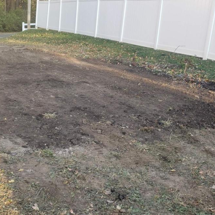 Blacktop demo New gravel spread