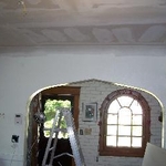 Installing drywall over plaster