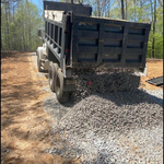 Laying Driveway with Dumptruck
