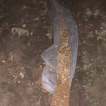 French drain ready to be covered with topsoil