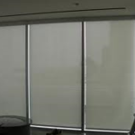 Triple slider roller shades