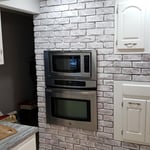 Cabinets and brick wall