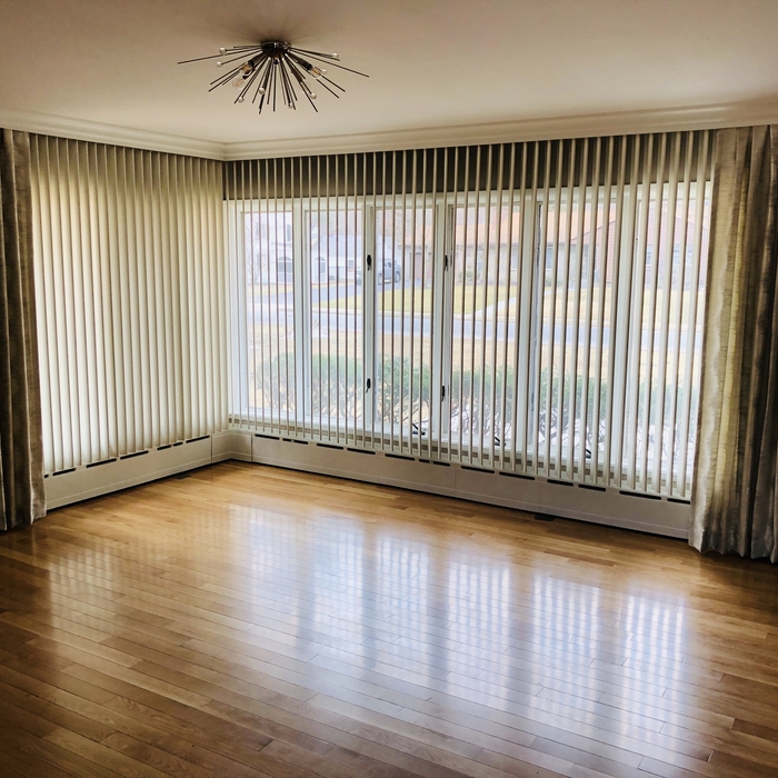 Drapery panels over verticals