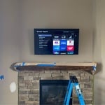 Tv mount above fireplace