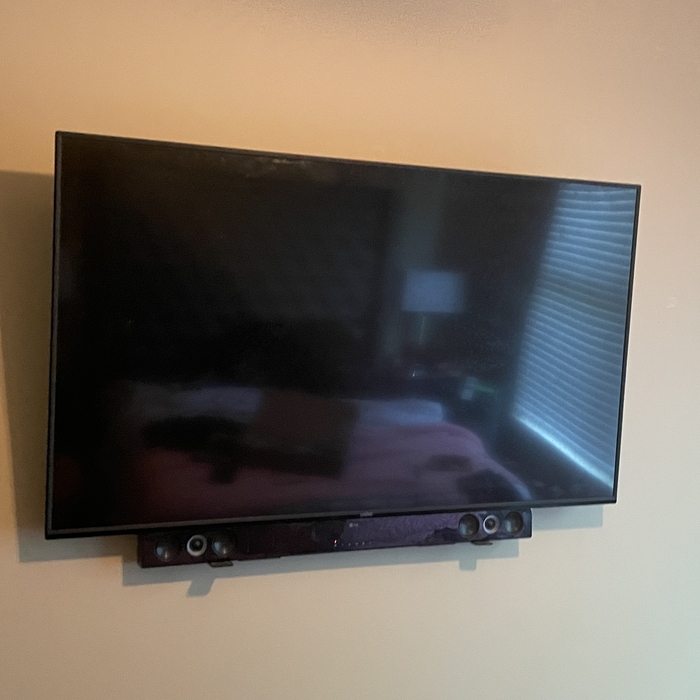 Tv with sound bar mounted