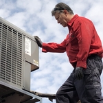 inspecting roof portion of HVAC system