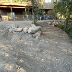 Walk area between fire pit and horse shoe play are