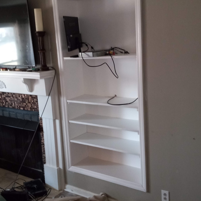 Recessed towel shelf