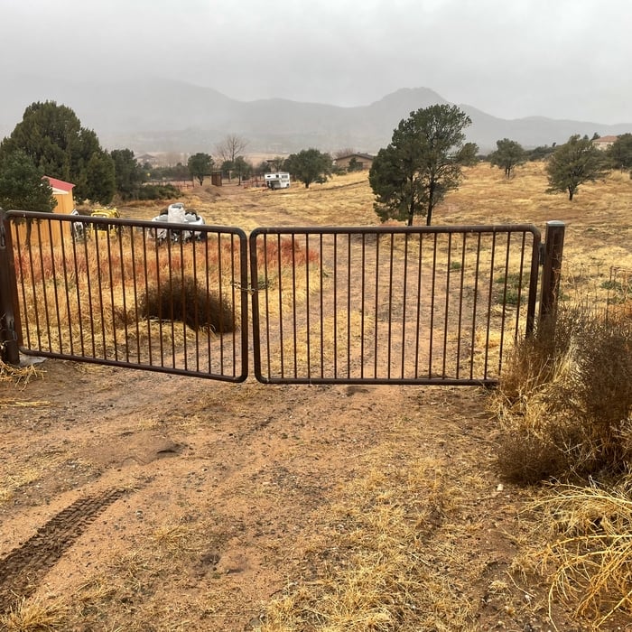 Gate hinges welded back on and gate installed