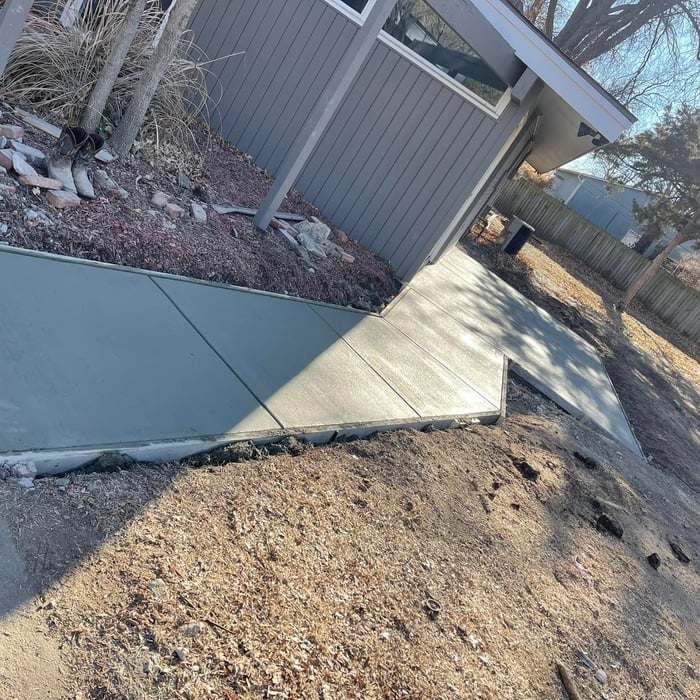 Sidewalk with patio area.