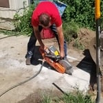 Cutting out cement to access pipes
