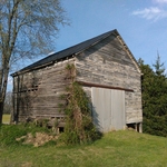 Before view of deteriorating siding and piers