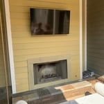 55" TV over Outdoor Pool Deck Fireplace