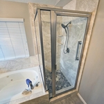 Completed walk-in shower with the shower enclosure