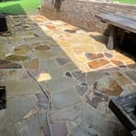 Before pressure washing back patio