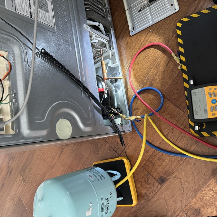 Recharging system with refrigerant.