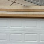 Monsoon weather winds bent this door. Godstone Garage Door Service was there to assist and replace the door ASAP for the customer.
