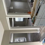 Install baseboard and casing molding.
