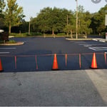 Asphalt sealcoating