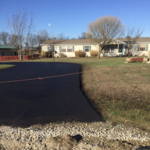 Asphalt sealcoating