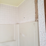 Old tile above the tub surround